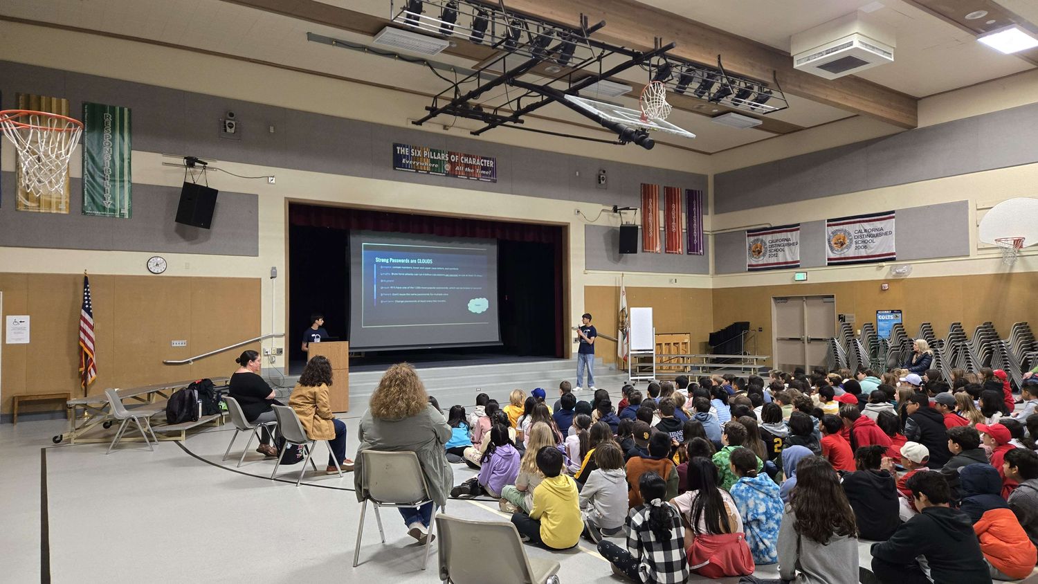 A CyberCEO member presenting the CLOUDS password rule to a full elementary school assembly