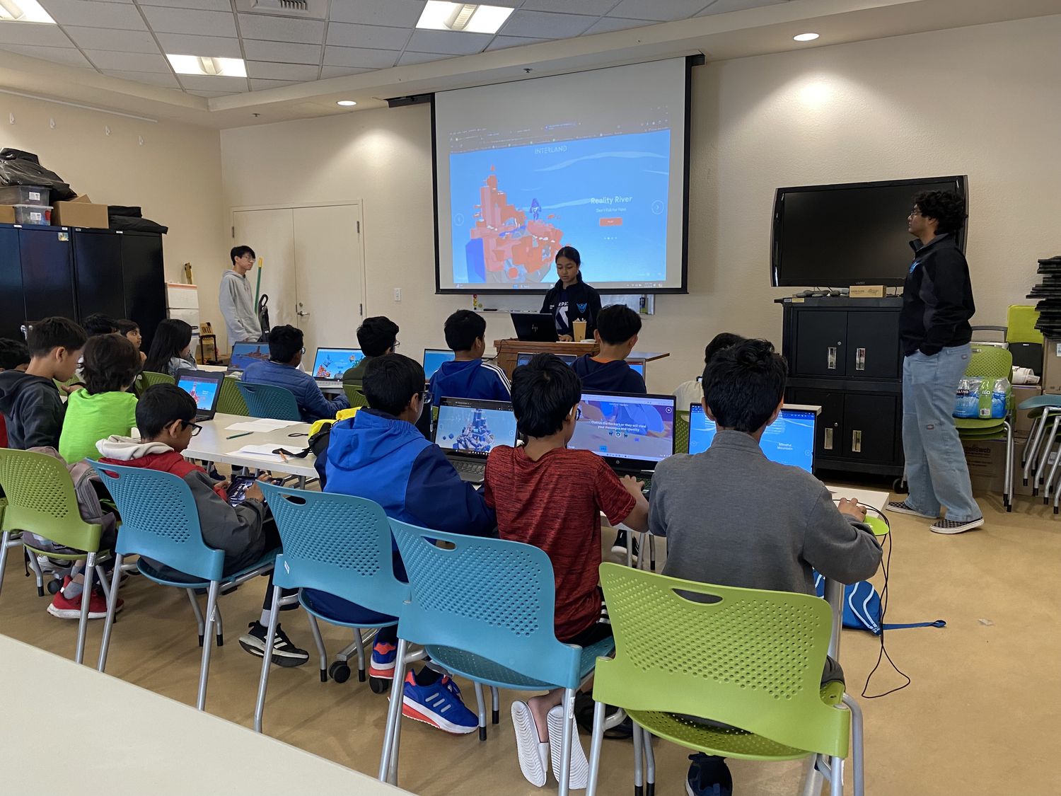 Students working through a cyber safety game on laptops at 4S Ranch Library