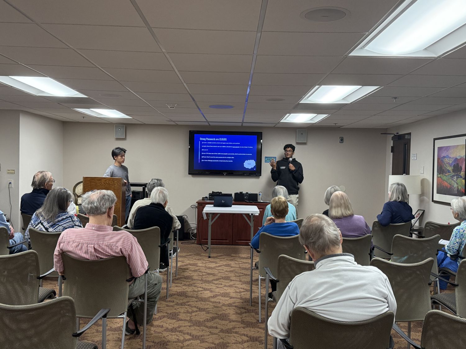 A CyberCEO member teaching the CLOUDS password rule to residents at Casa de las Campanas